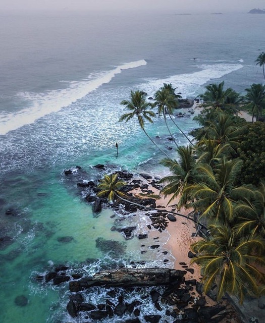 Scuba diving over a reef and shipwreck near Hikkaduwa, Sri Lanka